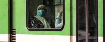 An old woman in metro. back to live after the 1st wave of coronavirus COVID-19